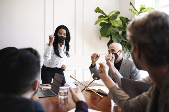 Business people wearing masks in coronavirus meeting, the new normal